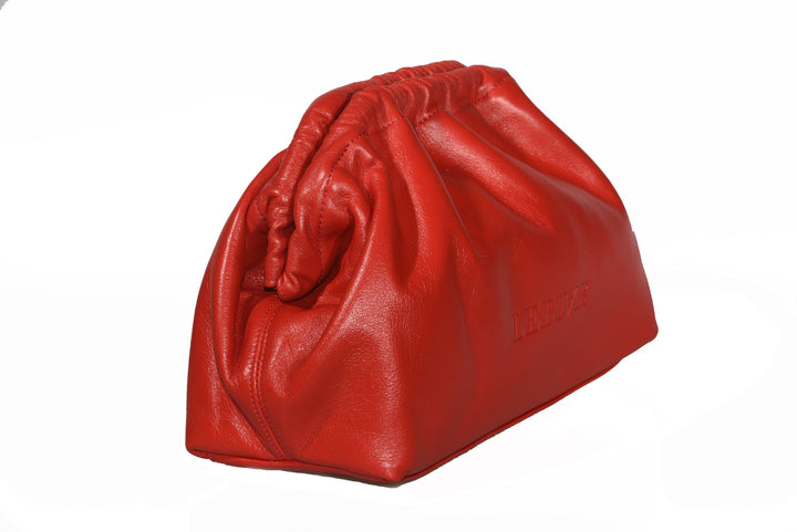Red leather clutch bag with ruched detailing