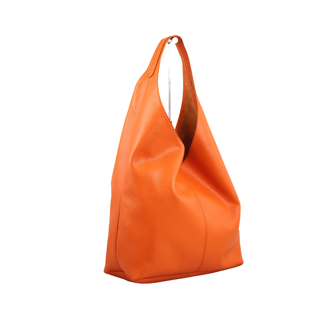 Bright orange leather tote bag with slouchy design and shoulder strap