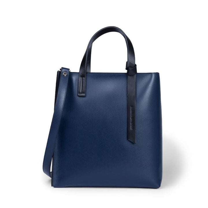 Sleek navy blue leather tote bag with shoulder strap and handles