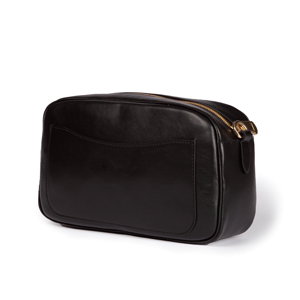 Sleek black leather toiletry bag with gold zipper