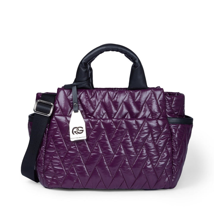 Purple quilted handbag with black handles and an adjustable shoulder strap