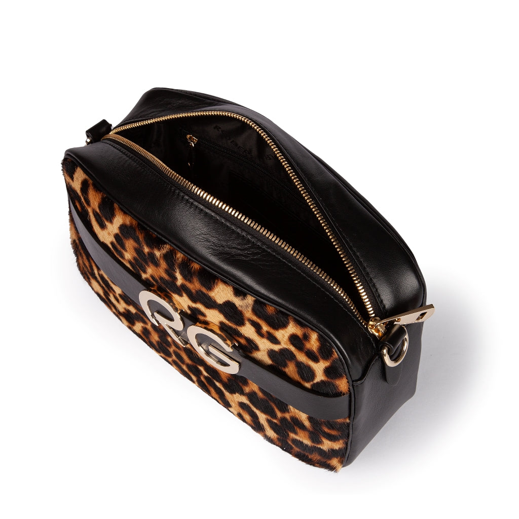 Leopard print designer handbag with gold zipper and black leather accents