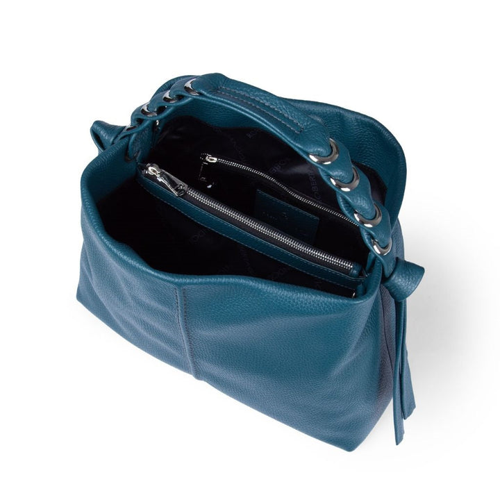 Blue leather handbag with open top, zipper compartments, and metallic handle rings