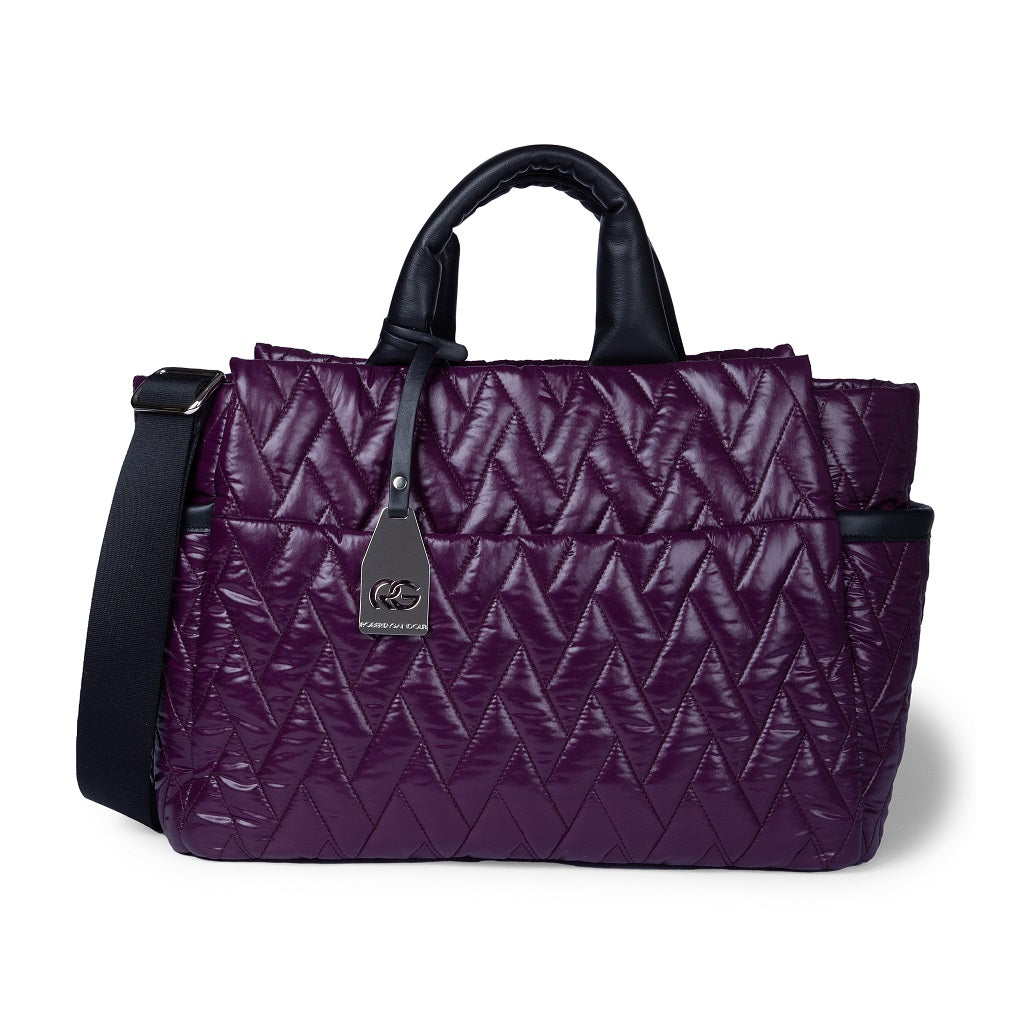 Stylish quilted purple handbag with black strap and metallic logo charm