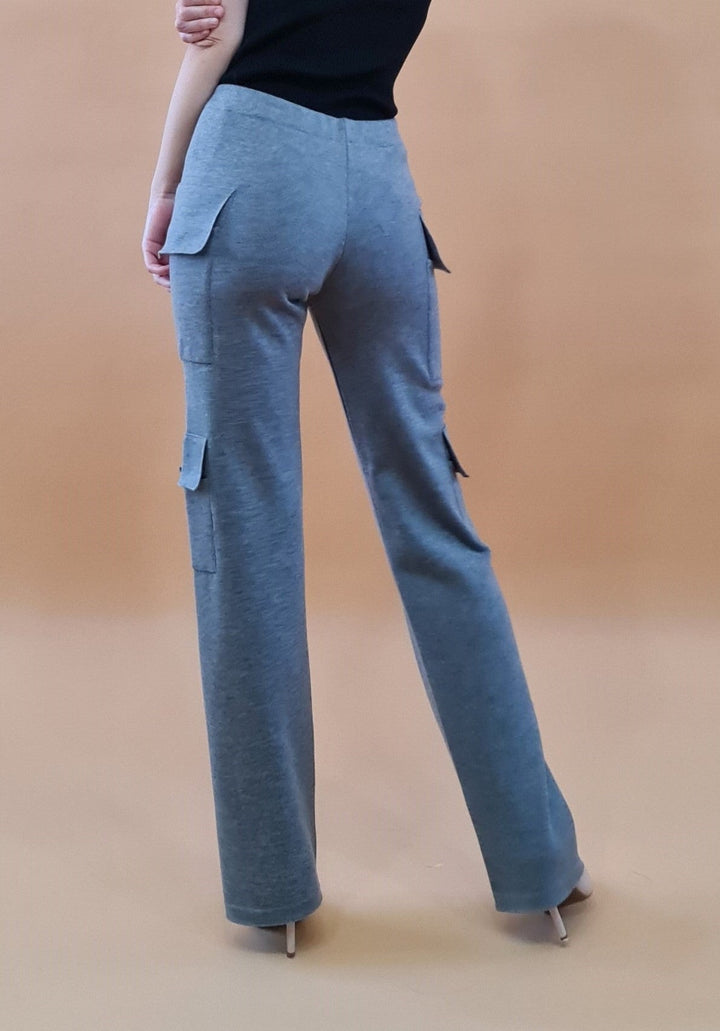 Rear view of a person wearing grey high-waisted, wide-leg pants with pockets