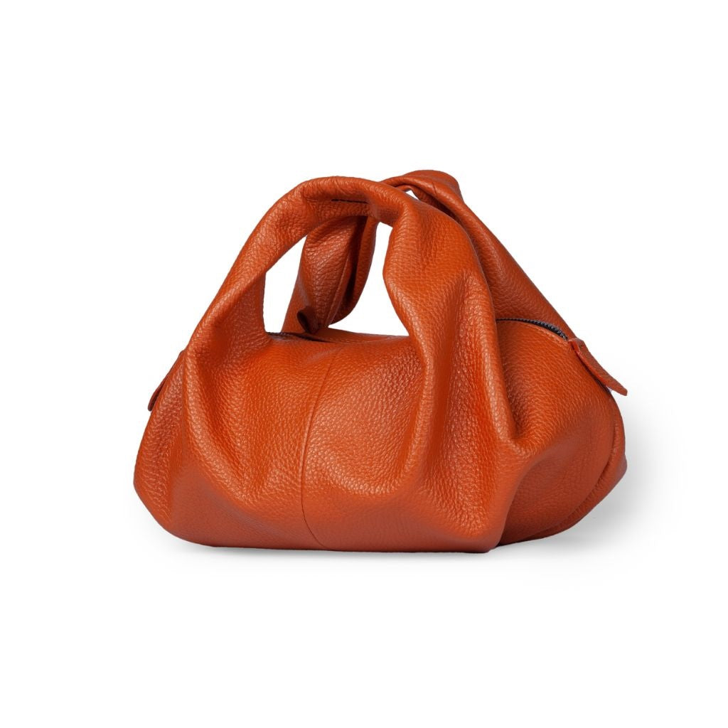 Orange leather handbag with unique knotted design