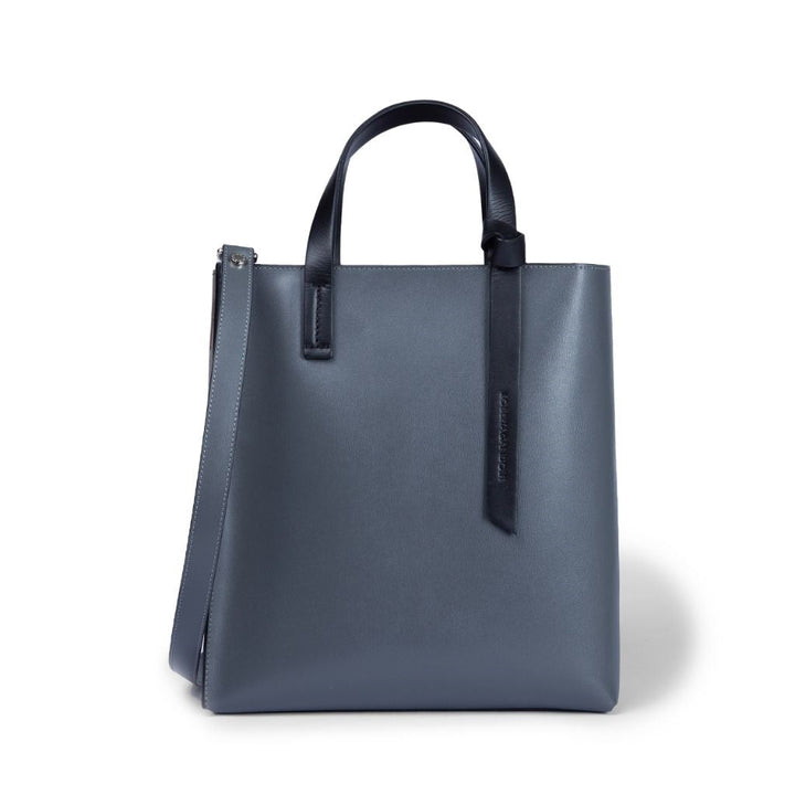 Elegant blue leather tote bag with handles and shoulder strap