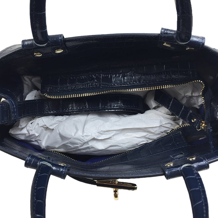 Open blue leather handbag with multiple compartments and gold zipper details
