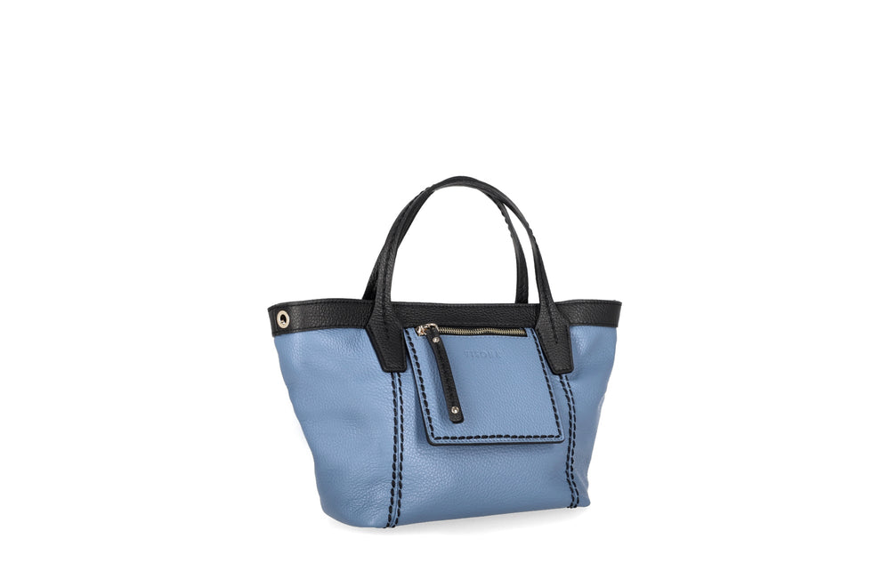 Blue leather handbag with black handles and pocket detailing