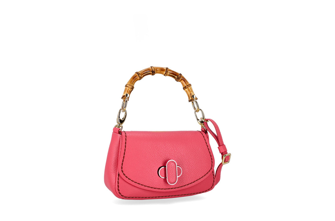Pink leather handbag with bamboo handle and gold hardware