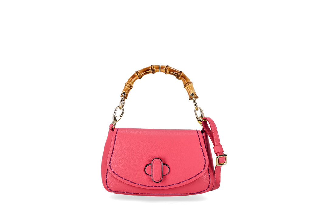 Pink leather handbag with bamboo handle and gold fittings