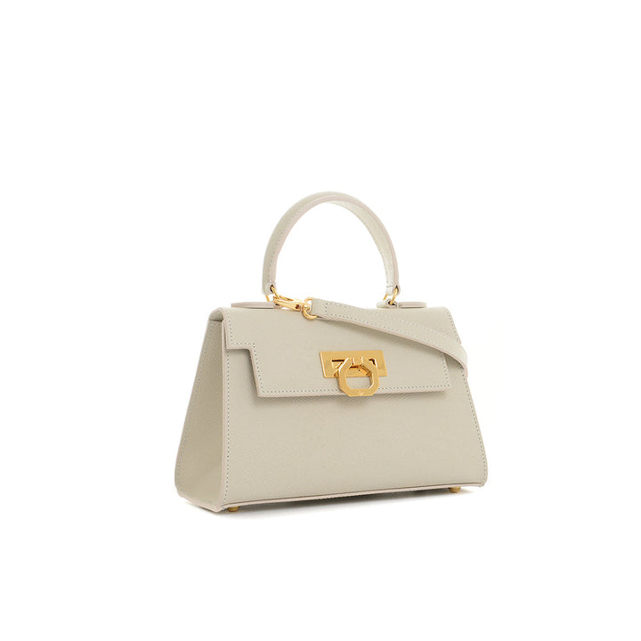 Elegant beige leather handbag with gold hardware and top handle