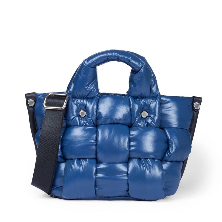 Blue quilted puffer handbag with black shoulder strap and silver hardware