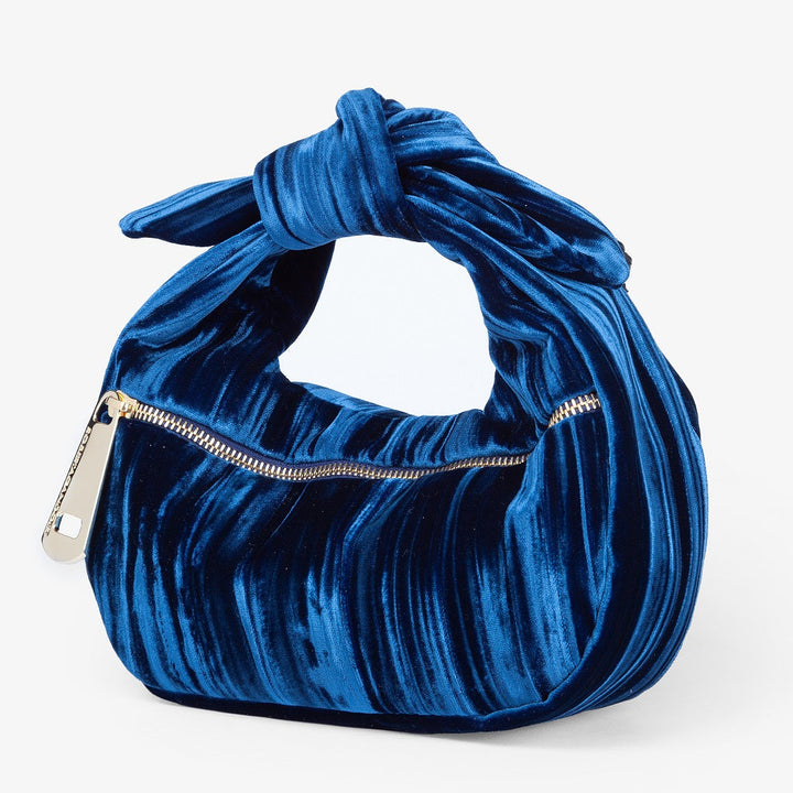 Blue velvet handbag with knotted handle and gold zipper