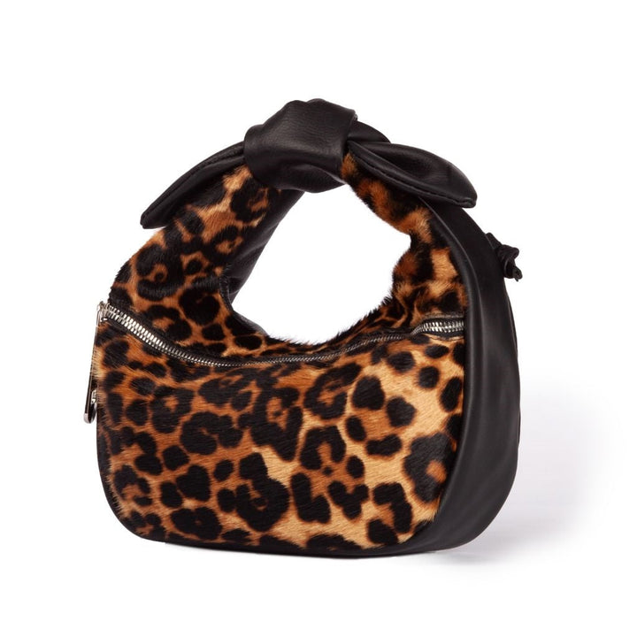 Leopard print handbag with black leather trim and zip closure