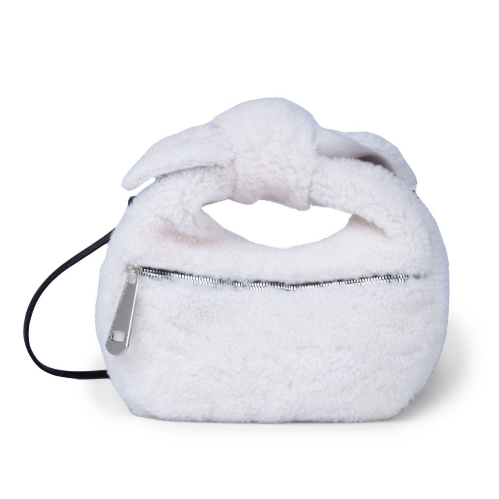 Fluffy white handbag with zipper and bow detail on top