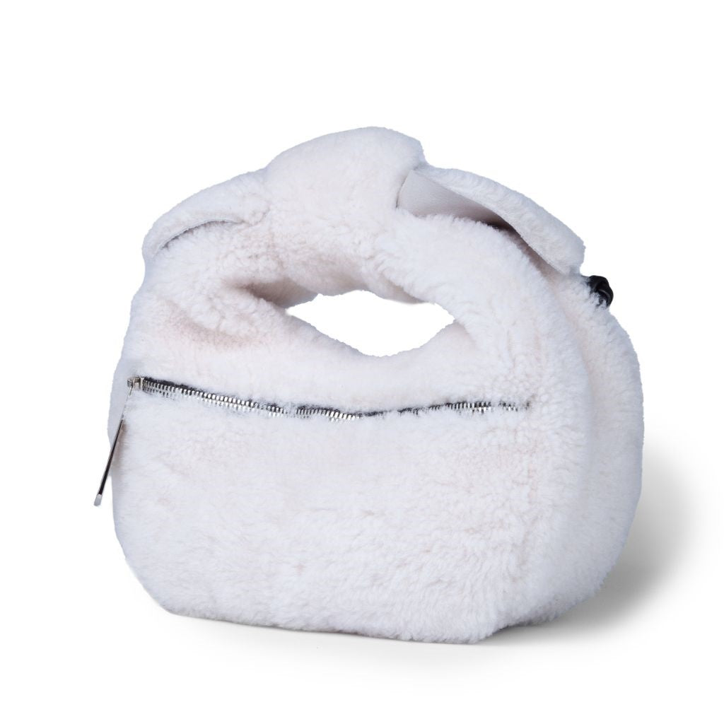 White faux fur handbag with zipper closure and handle loop