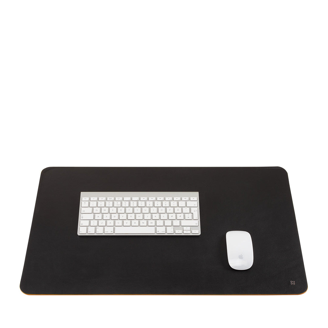 Black leather desk mat with white keyboard and mouse