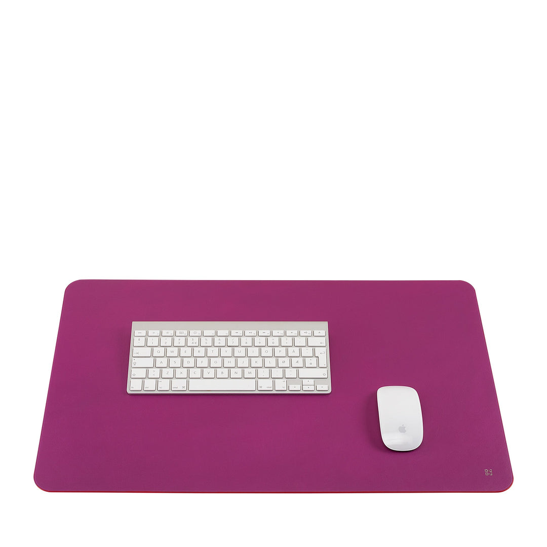 Purple desk mat with white keyboard and mouse