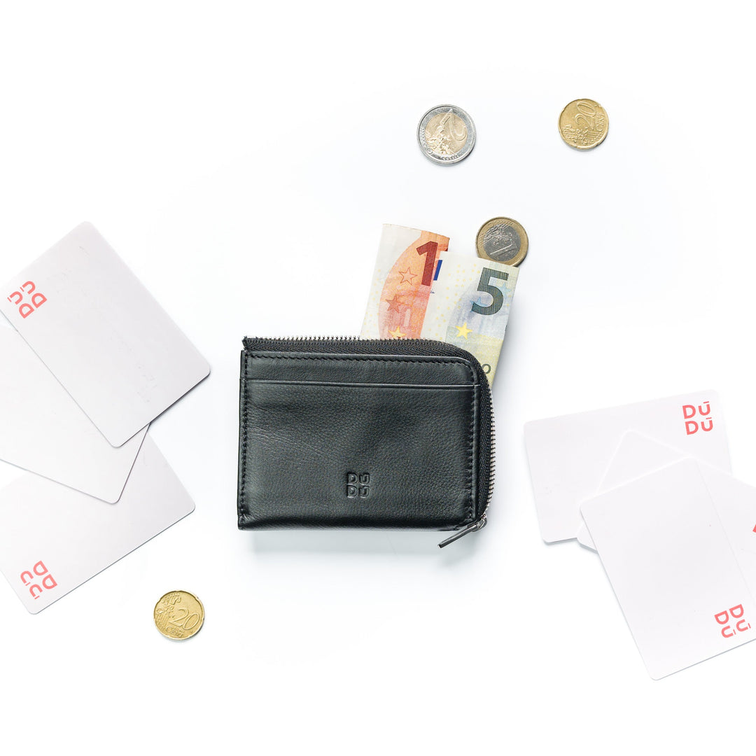 Black leather wallet with Euro currency, coins, and credit cards on a white background