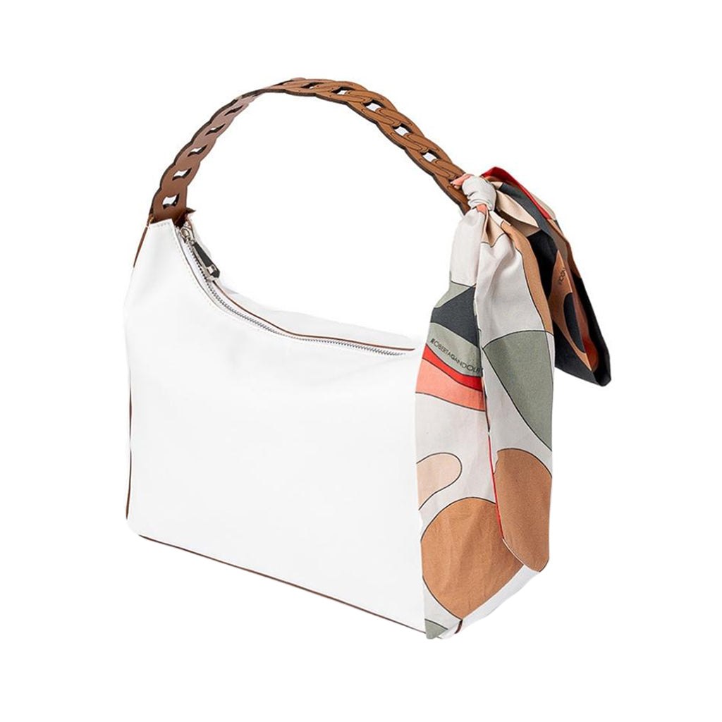 White handbag with woven leather strap and colorful scarf accessory