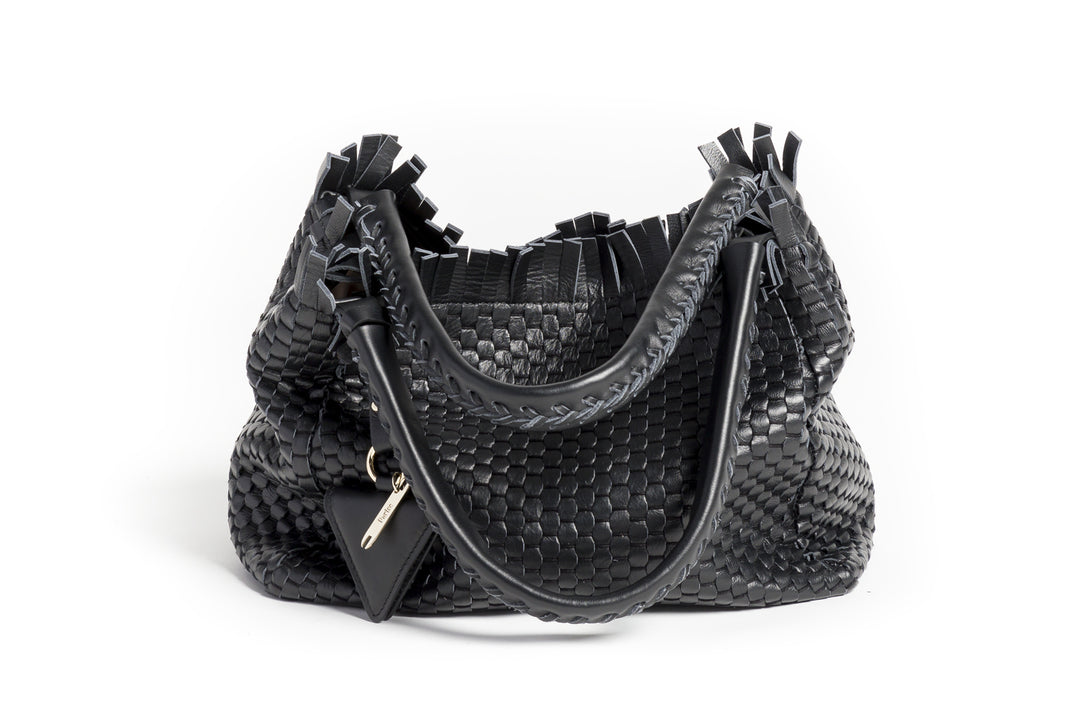 Elegant black woven leather handbag with decorative gold key charm and stylish fringe details.