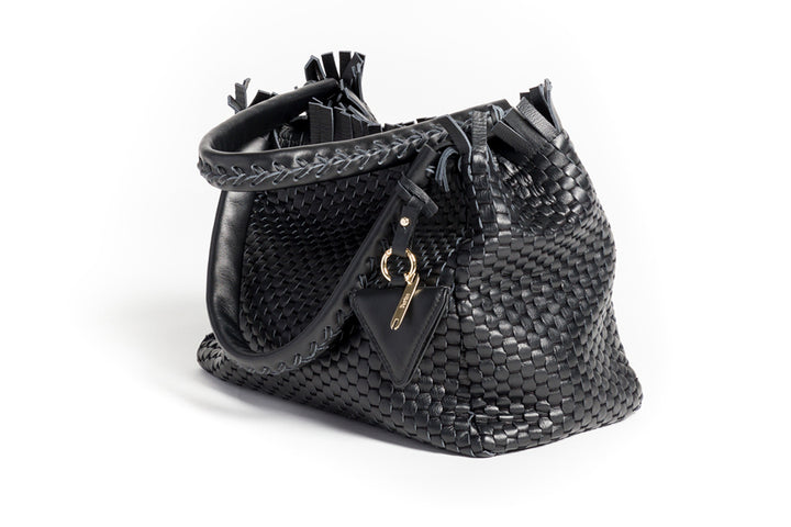 Elegant black woven leather handbag with decorative gold key charm and stylish fringe details.