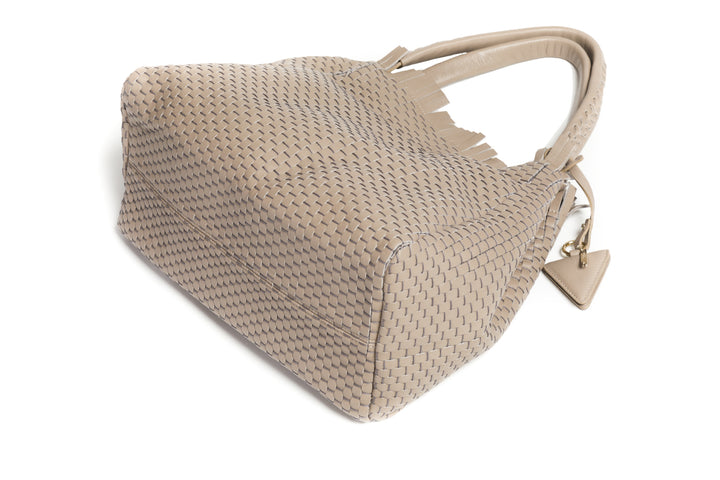 Elegant beige woven handbag with dual handles and tag.