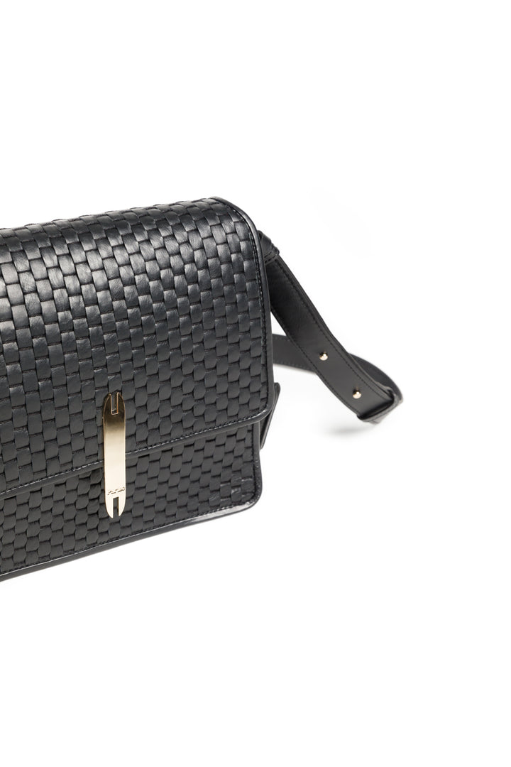 Black woven leather handbag with shoulder strap on white background.