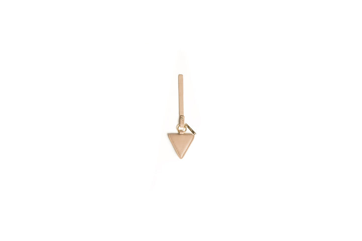 Beige triangular leather keychain on a white background