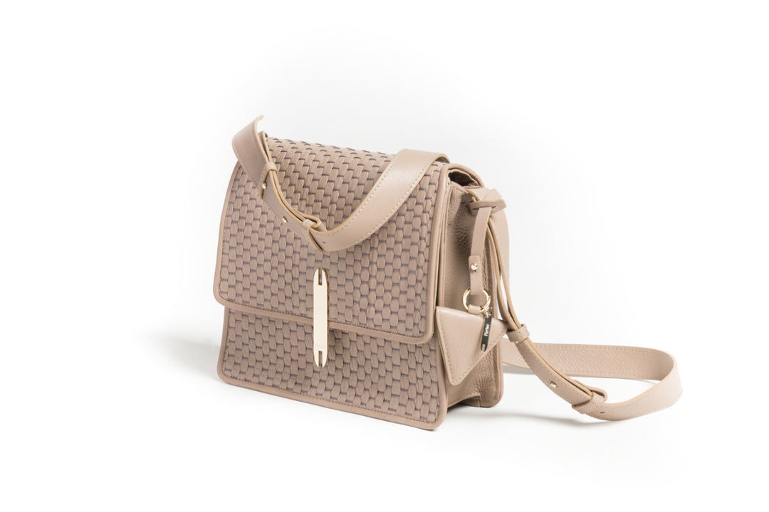 Tan woven leather crossbody handbag with adjustable strap.