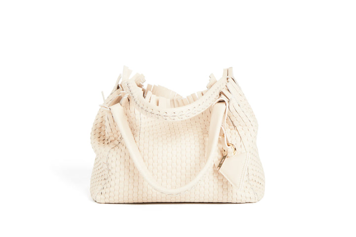 Elegant ivory woven handbag with tassel detail and braided handles.