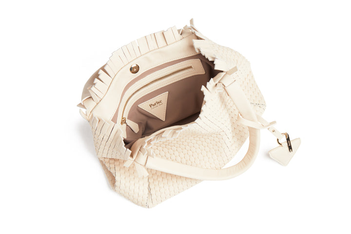 Elegant ivory woven handbag with tassel detail and braided handles.