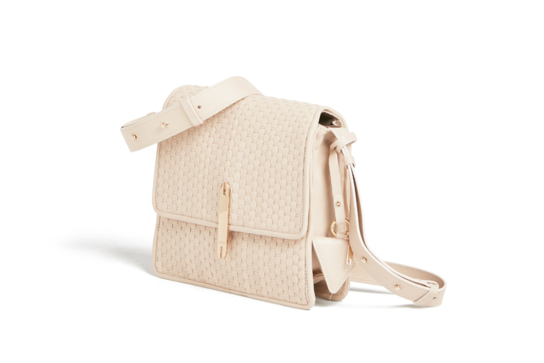 Elegant beige woven leather handbag with adjustable strap and gold accents.