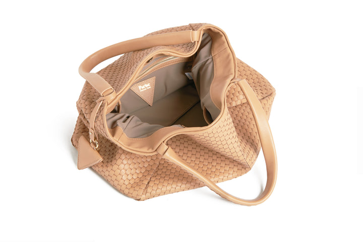 Elegant woven beige leather handbag with braided handles.