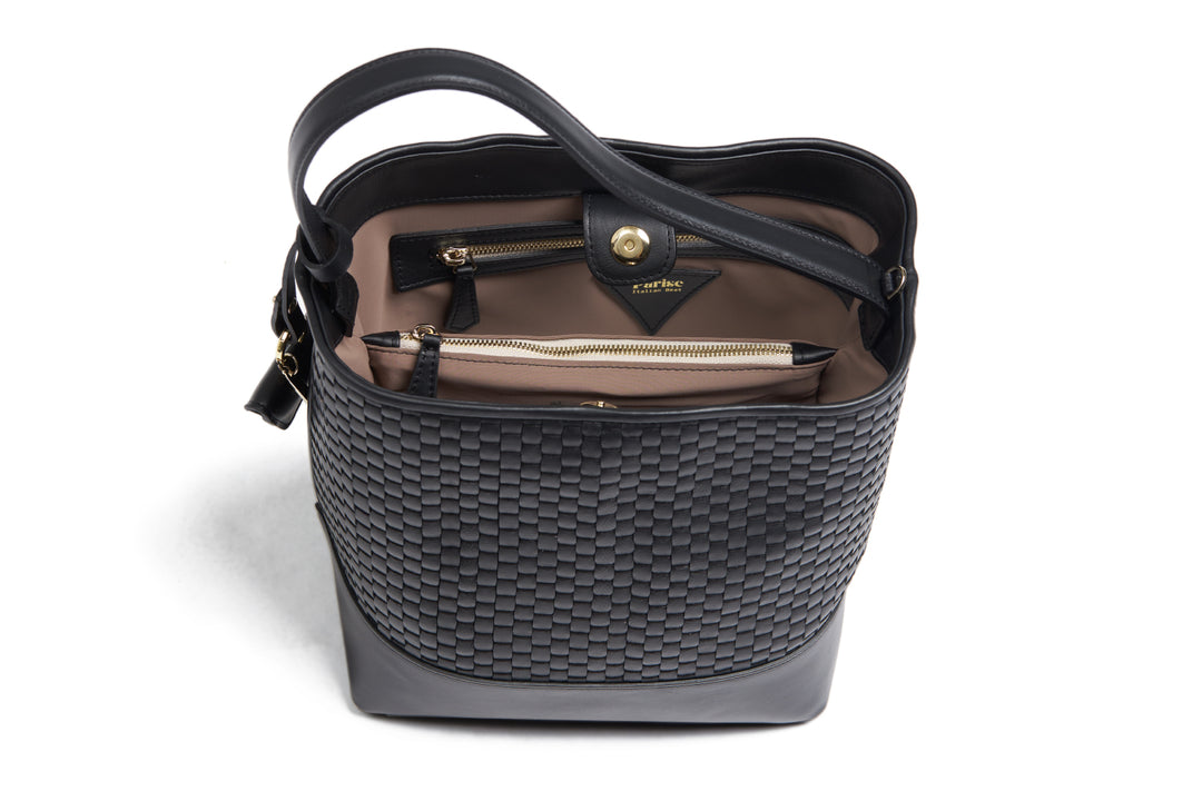 Black textured leather handbag with adjustable strap and gold-tone hardware.