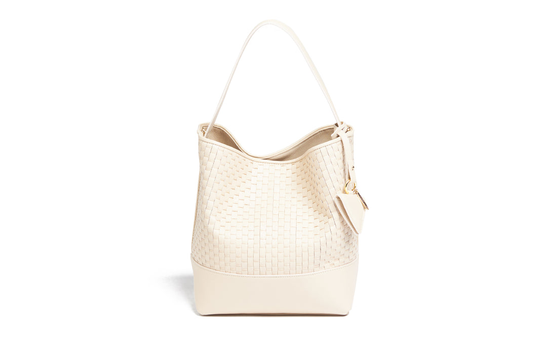 Elegant beige woven leather handbag with gold accents and adjustable strap.