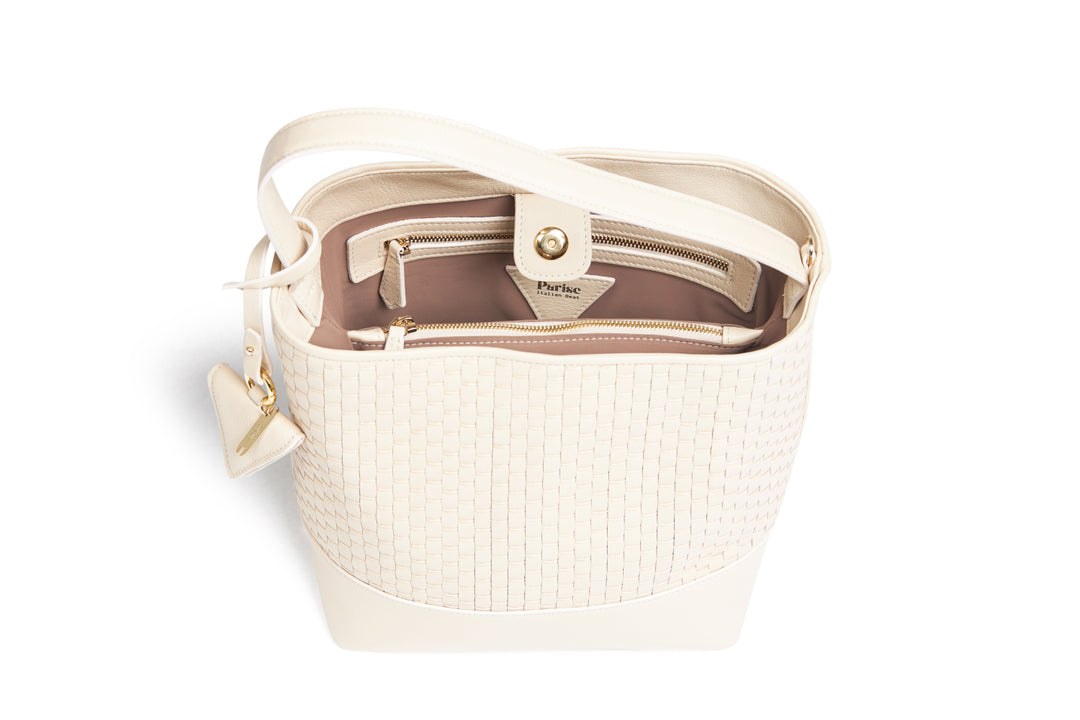 Elegant beige woven leather handbag with gold accents and adjustable strap.