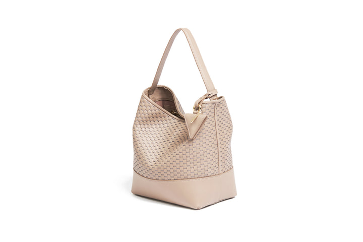 Beige woven leather handbag with adjustable strap on white background.