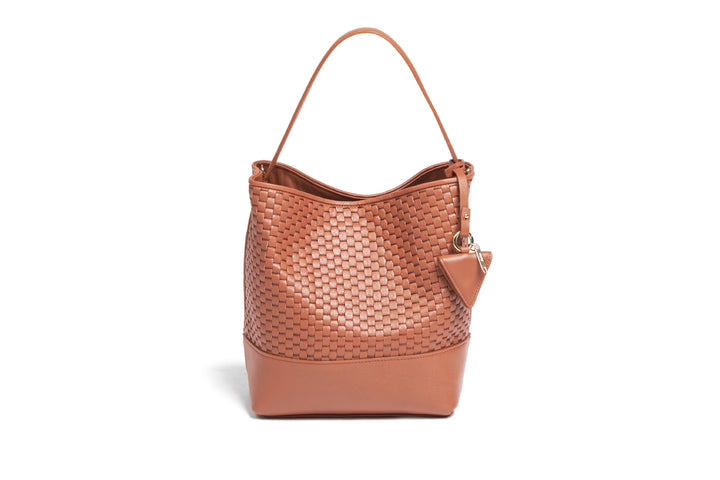 Elegant brown woven leather handbag with adjustable strap and minimalist design.