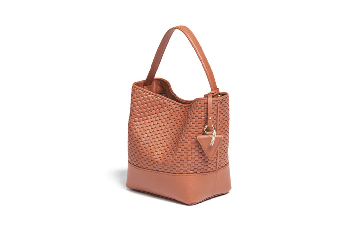 Elegant brown woven leather handbag with adjustable strap and minimalist design.