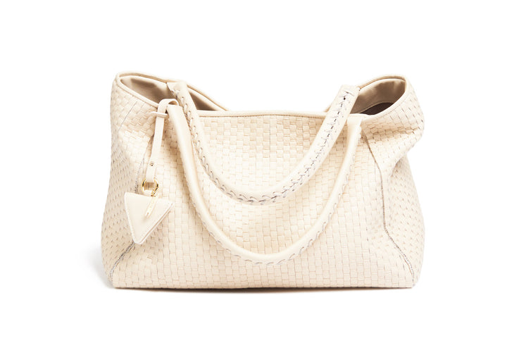 Elegant woven beige handbag with shoulder strap.