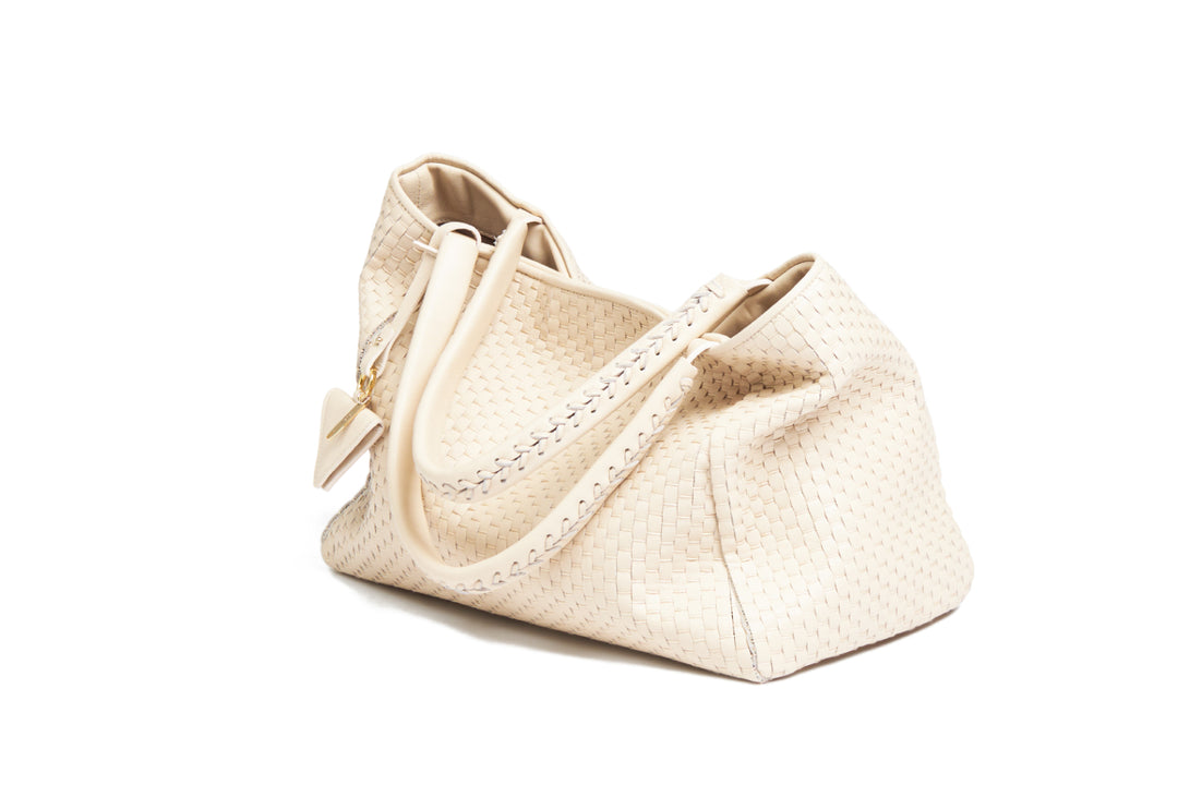 Elegant woven beige handbag with shoulder strap.