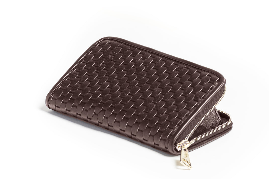 Alt: Brown woven leather zip wallet on white background