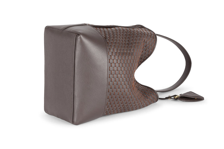 Alt tag: Elegant brown woven leather handbag with adjustable shoulder strap and small attached pouch