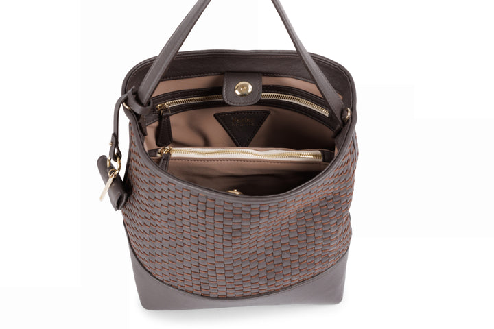 Alt tag: Elegant brown woven leather handbag with adjustable shoulder strap and small attached pouch