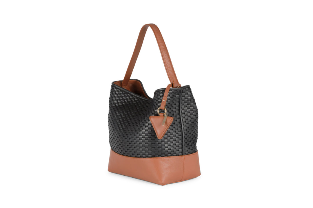 Woven black and brown leather shoulder bag with adjustable strap and triangle tassel.