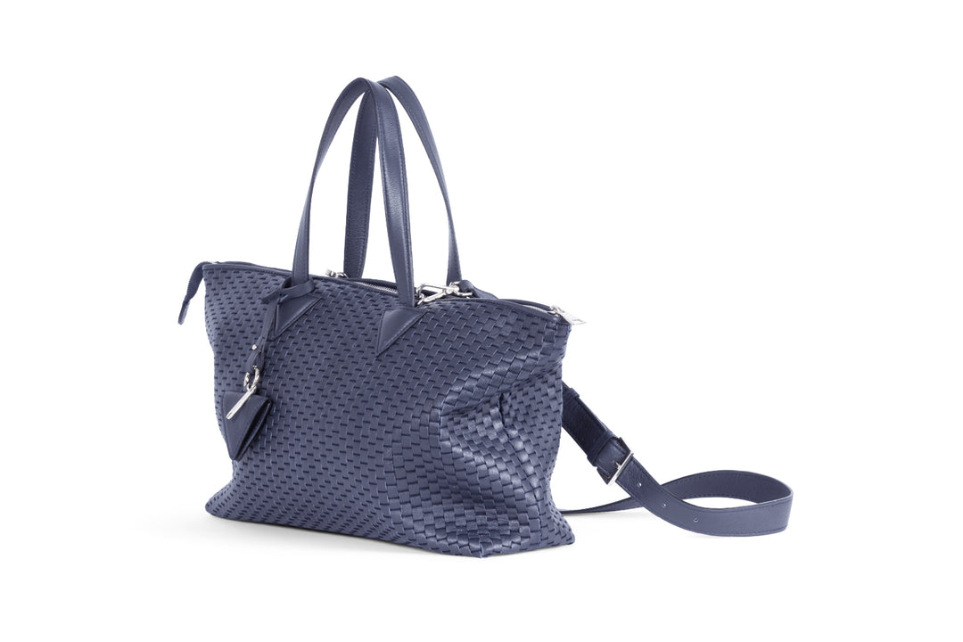 Elegant navy blue woven leather handbag with detachable shoulder strap.