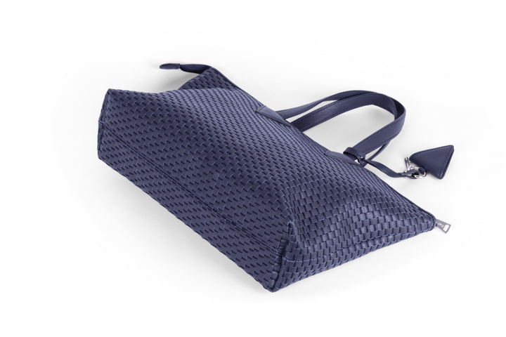 Elegant navy blue woven leather handbag with detachable shoulder strap.