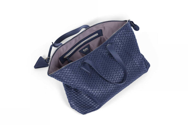 Elegant navy blue woven leather handbag with detachable shoulder strap.